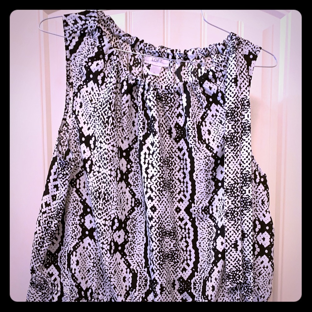 Black and white sleeveless blouse